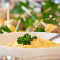 a bowl of food with broccoli in it