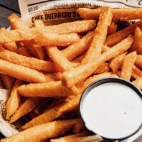 fried fries on white paper