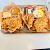 a couple of trays of food on a table